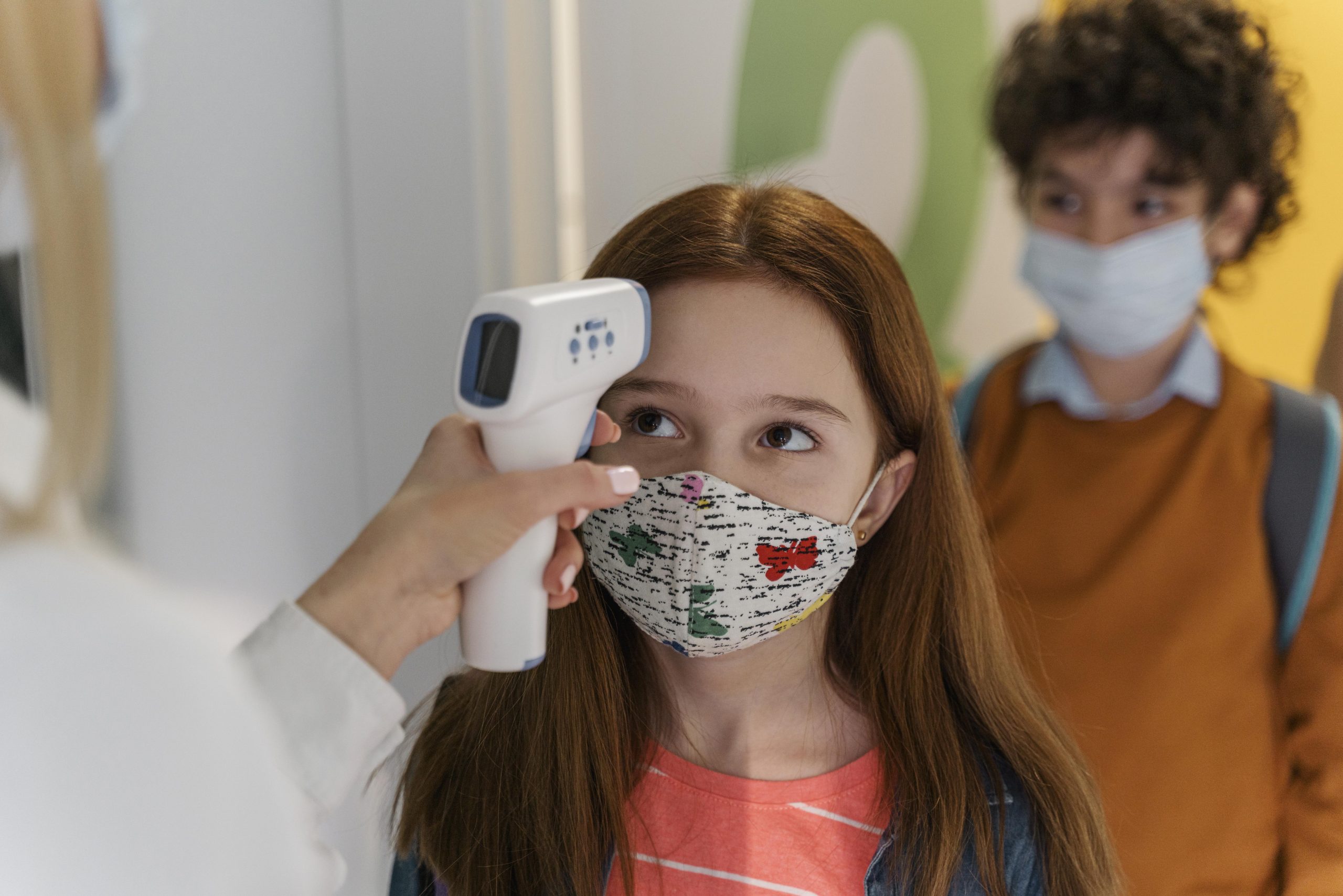 Teacher With Medical Mask Checking Children S Temperature School Scaled